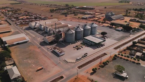 Aerial drone orbiting grain silos warehouse in Minas Gerais, Brazil Stock Footage 341052466