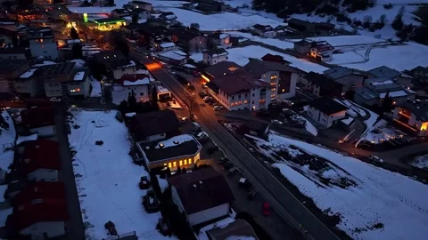 Aerial Drone Orbiting Over Snow-Covered Alpine Village Nauders at Night, Austria Stock-Footage 333315951