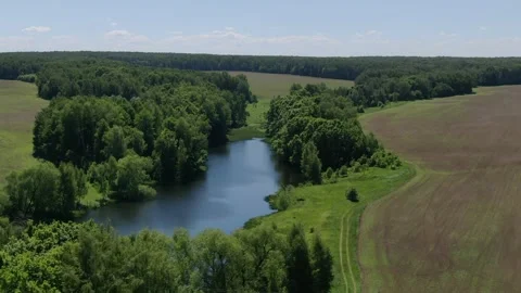 Aerial drone orbiting river and rising above landscape Stock Footage 331874168