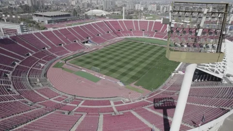 Aerial Drone Orbiting Shot Around Estadio Nacional de Chile And Floodlight Tower Stock Footage 344913937