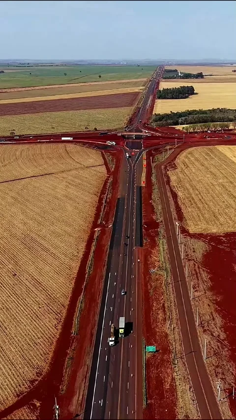 Aerial drone over agricultural fields and highway intersection, 9:16 Stock-Footage 332955737