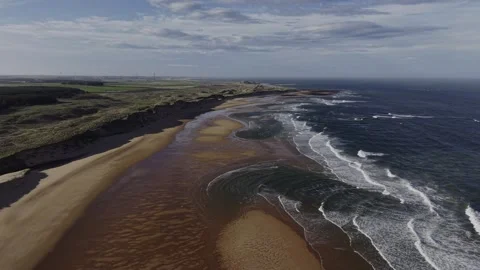 Aerial Drone Over Coastal Cliffs and Sandbar with Ocean Waves Video stock 333784403