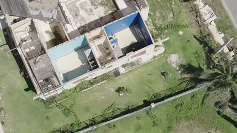 Aerial drone over damaged rooftops Stock Footage 341341548
