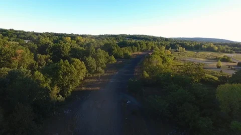 Aerial Drone Over Empty Trail Surrounded By Woods Stock-Footage 112275991