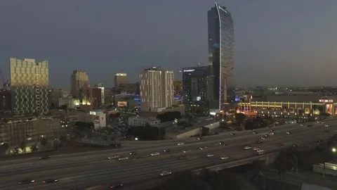 Aerial drone over freeway to Los Angeles skyline Stock Footage 77513437
