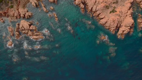 Aerial drone over head view of fantastic wild rocky coastline, turquoise blue Vídeo Stock 119235844