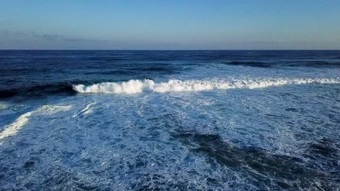 Aerial drone over ocean waves crashing with tilt down Stock Footage 111758620