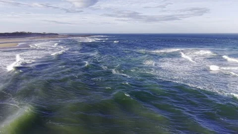 Aerial Drone Over Ocean Waves Near Sandy Beach Coastline Video stock 333784306