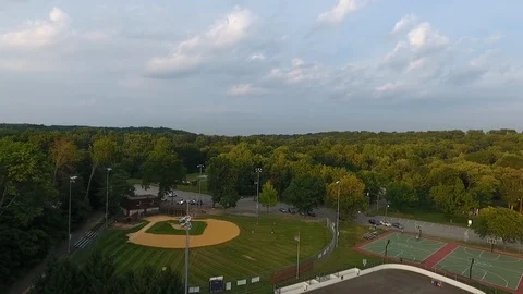 Aerial Drone Over Park Surrounded By Woods 스톡 동영상 112274018