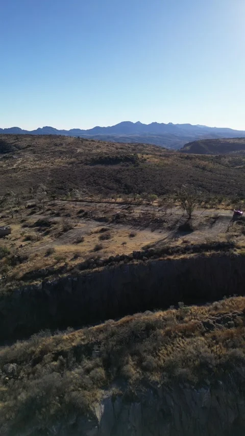 Aerial drone over a river canyon and dry scrubland, Aguascalientes, Mexico Stock Footage 341548064
