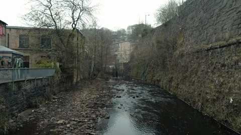 Aerial drone over river prone to flooding at Hebden Bridge, Yorkshire Video stock 110824488