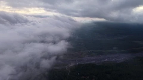 Aerial Drone Over Rolling Clouds Above Forested Valley Video stock 346913214