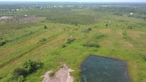 Aerial Drone Pan Left Over Rural Landscape and Water Pond 4K Stock Footage 337598255