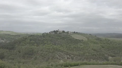 Aerial drone pan tracking a castle on a hill Tuscany Italy IT TUS DJI 0379 A Stock Footage 140193645