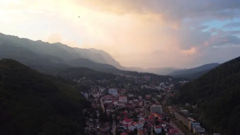Aerial drone with panning motion view of Sinaia city at sunset Stock Footage 248741771