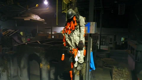 Aerial: Drone Panning Over Objects And Props Amidst Cottages At Illuminated Film Video stock 248487233