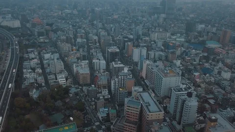 Aerial drone panning up towards the Tokyo city skyline in Japan on an Stock Footage