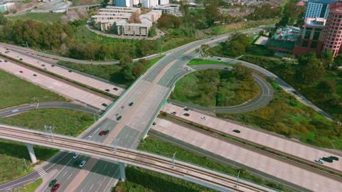 Aerial drone panorama of intersecting freeway bridges and highway lanes Stock Footage 330516504