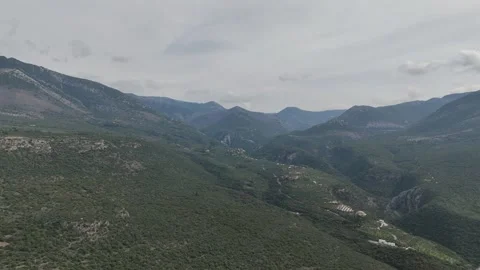 Aerial drone panorama of rugged mountain range and green valley landscape Stock-Footage 331078024