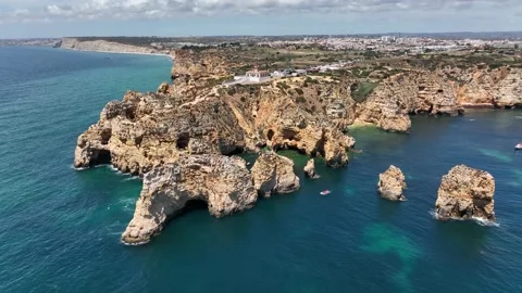 Aerial drone panorama view of idyllic nature landscape rocky cliff boats sailing Stock Footage 201730350
