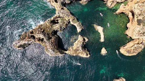 Aerial drone panorama view of idyllic nature landscape rocky cliff boats sailing Stock Footage 201730428