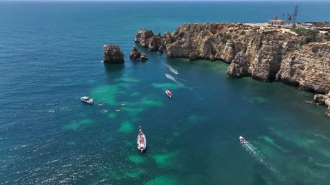 Aerial drone panorama view of idyllic nature landscape rocky cliff boats sailing Stock Footage 201731231