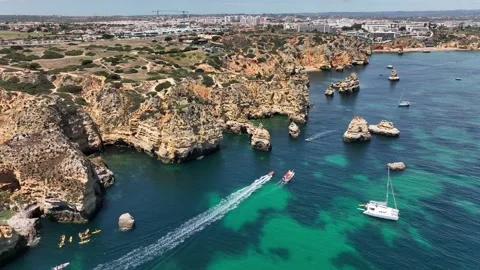 Aerial drone panorama view of idyllic nature landscape rocky cliff boats sailing Stock Footage 201731471