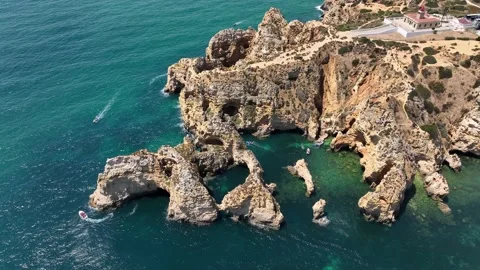 Aerial drone panorama view of idyllic nature landscape rocky cliff boats sailing Stock Footage 201732195