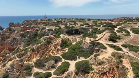 Aerial drone panorama view of idyllic nature landscape rocky cliff boats sailing Stock Footage 201732571