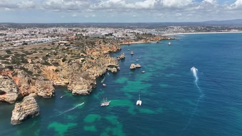 Aerial drone panorama view of idyllic nature landscape rocky cliff boats sailing Stock Footage 201732613