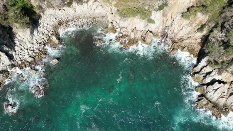 Aerial drone panoramic view, bay with clean blue sea water, rocks and cliffs, 4K Stock Footage 274817231