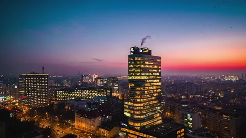 Aerial drone panoramic view of Bucharest city skyline Victory Square at dusk Stock Footage 131235754