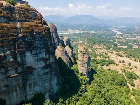 Aerial drone panoramic view of deep gorge and rocky ridge leading to legendar Stock Photos