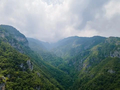 Aerial drone panoramic view of deep gorge and rocky ridge leading to legendar Stock Photos
