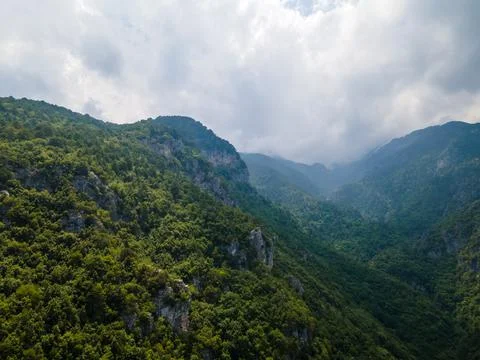 Aerial drone panoramic view of deep gorge and rocky ridge leading to legendar Stock Photos
