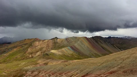 Aerial drone panoramic view of the rainbow colored mountain and huge Andes peaks Stock Footage 105886522
