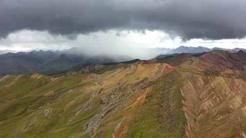 Aerial drone panoramic view of the rainbow colored mountain and huge Andes peaks Stock Footage 105886695