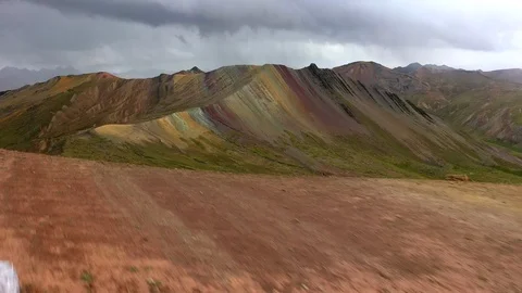 Aerial drone panoramic view of the rainbow colored mountain and huge Andes peaks Stock Footage 105887267