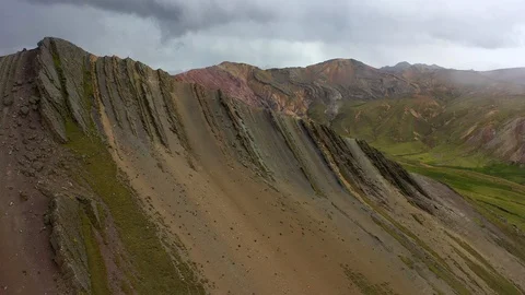 Aerial drone panoramic view of the rainbow colored mountain and huge Andes peaks Stock Footage 105887373