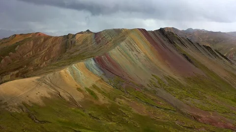 Aerial drone panoramic view of the rainbow colored mountain and huge Andes peaks Stock Footage 105887403