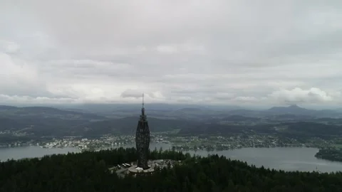 Aerial drone panoramic view of Tower Pyramidenkogel lake Worthersee Austria Stock Footage 131222824