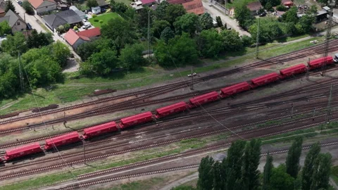 An aerial drone perspective of a long freight train transporting cargo through Stock Footage 337470900