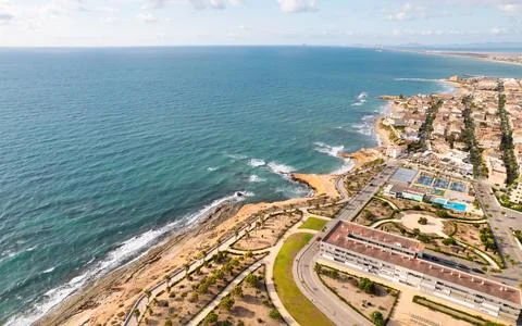 Aerial drone point of view empty beach of Mil Palmeras. Spain Stock Photos
