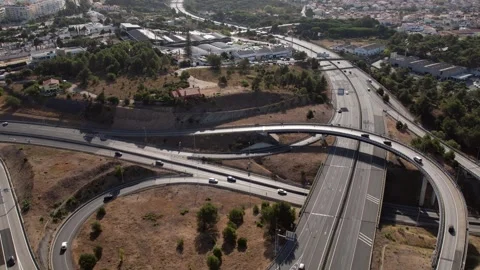 Aerial drone POV tracking of A5 highway and junctions in Cascais, Portugal Stock Footage 248768229