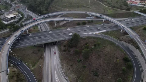 Aerial drone POV tracking of A5 highway in Cascais, Portugal at sunset Stock Footage 254207188