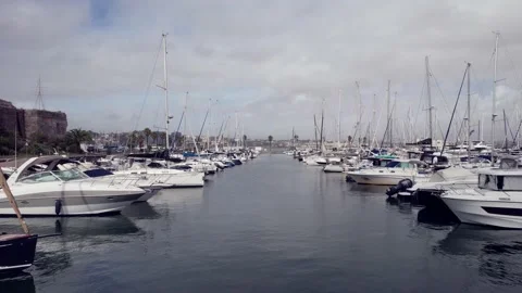 Aerial drone POV view between yachts moored at Cascais marina Stock Footage 209621822