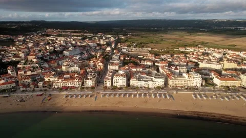 Aerial drone pull away from beach and bay at Sao Martinho do Porto in Portugal Stock Footage 246582864
