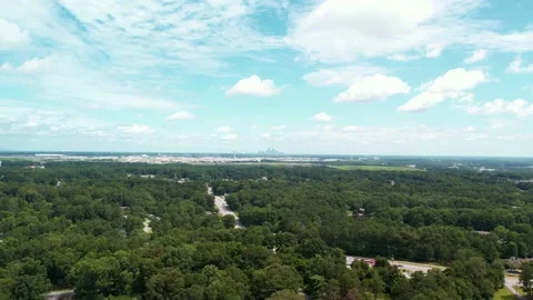 Aerial drone Pull away from major airport showing city in the background. Stock Footage 170721339