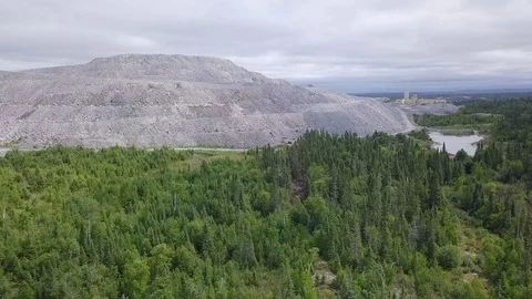 Aerial drone pull away from open-pit gold mine Stock-Footage 79602038