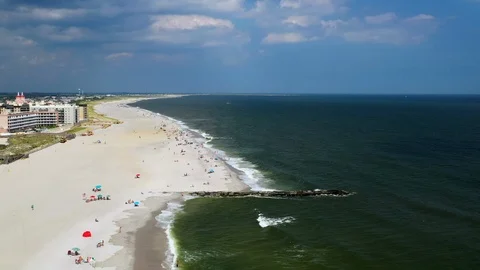 Aerial drone pull away over shoreline on the left in Long Beach in Long Stock Footage 112491300